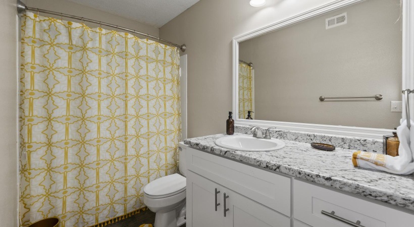 a bathroom with a large mirror