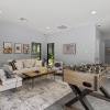 clubroom with a couch and game table