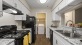 a kitchen with white cabinets