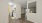a room with a wood floor and white walls