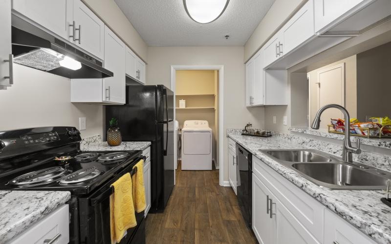 a kitchen with white cabinets