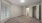a room with a carpet and windows