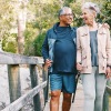 a couple walking together on a bridge