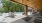 a patio with tables and chairs